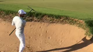 Man Makes Chip Shot with a Rake