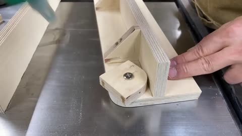 First fix the small piece of wood with a screw