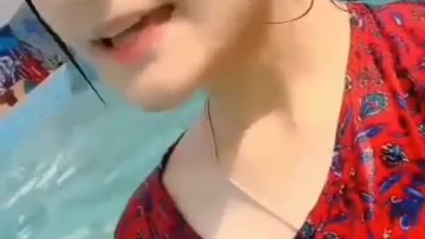 Cute teenage girl singing in pool