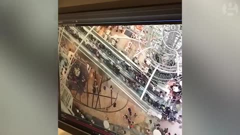 Hong Kong shoppers injured when escalator goes into reverse – video