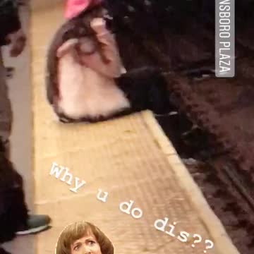 Girl fur jacket pink hat beret sitting hanging legs off subway tracks platform