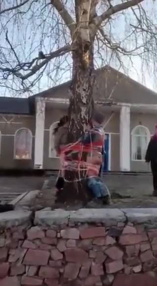 Ukraine: two people tied to tree, pants taken down, beaten