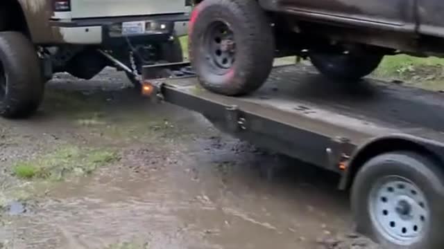 The lorry drove through standing water