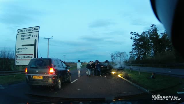 Car Rolls onto Its Roof