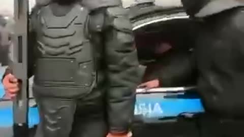 Footage from Almaty, police moving together with demonstrators in the city center