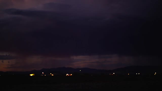 rain and lightning from the dark sky at the night