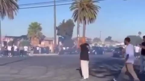 Man gets pocket checked and slapped after being hit by a car doing donuts 😬