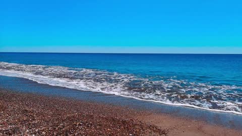 View Of Beach With Blue Waters