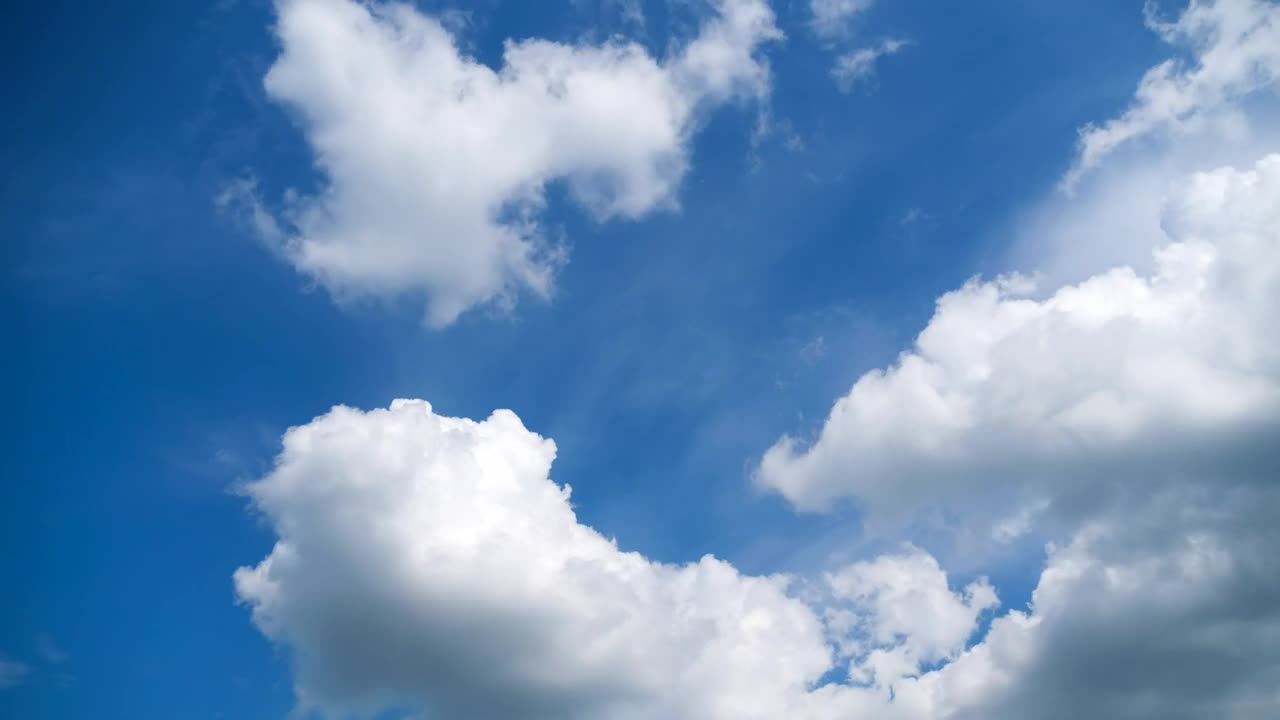 Clouds changing shapes is smoothly in the sky