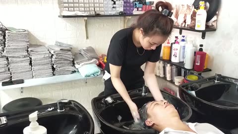Relax in vietnam barber shop, the black outfit highlights her fair skin and pretty beauty