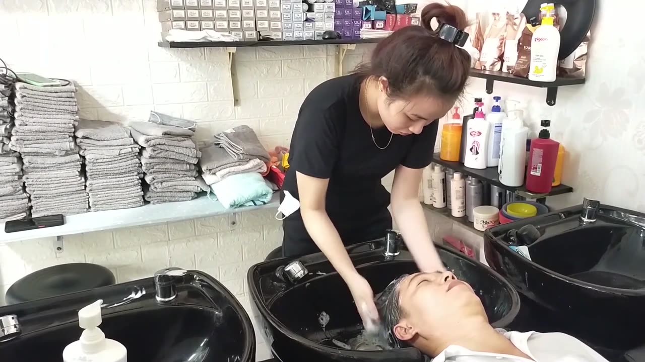 Relax in vietnam barber shop, the black outfit highlights her fair skin and pretty beauty