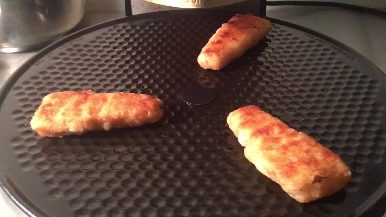 Frozen Grocery Fish Fillets Cooked On Portable Pizza Oven