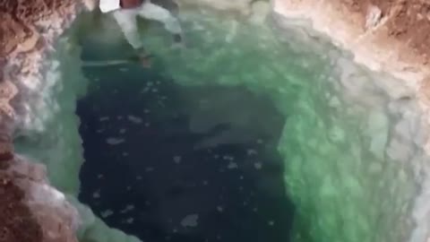 Man floats in salt pool in egypt