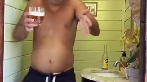 Man laughing about drinking