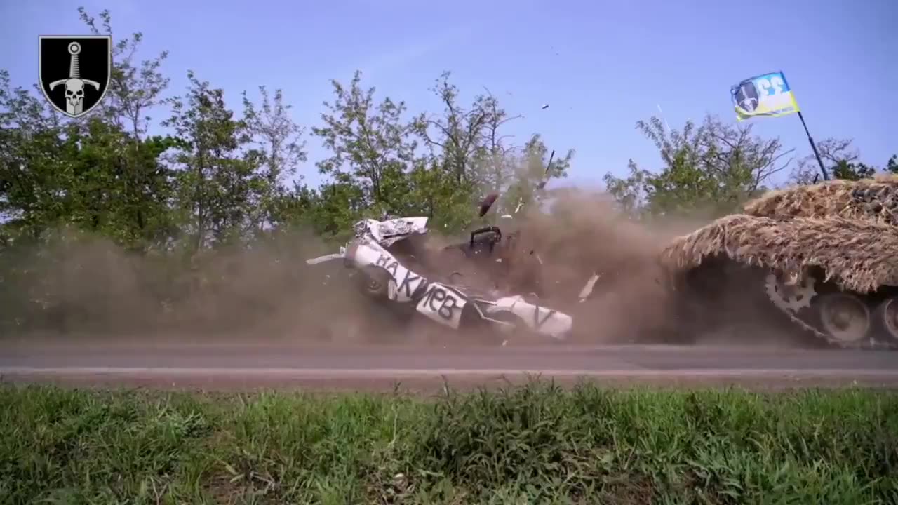 Ukrainians ran over their own car with a tank for some reason.