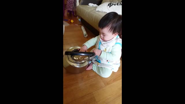 The baby who puts the lid on the kettle