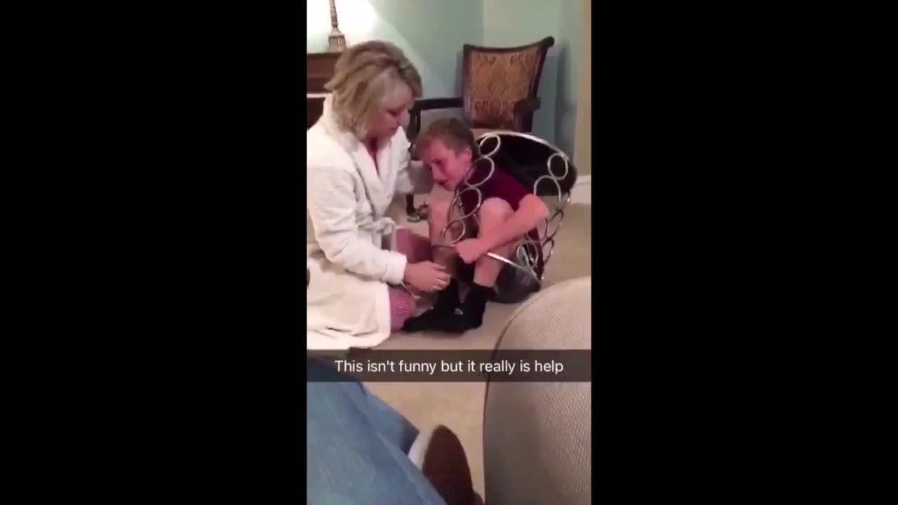 Curious Kid Manages To Get Himself Stuck Inside A Table