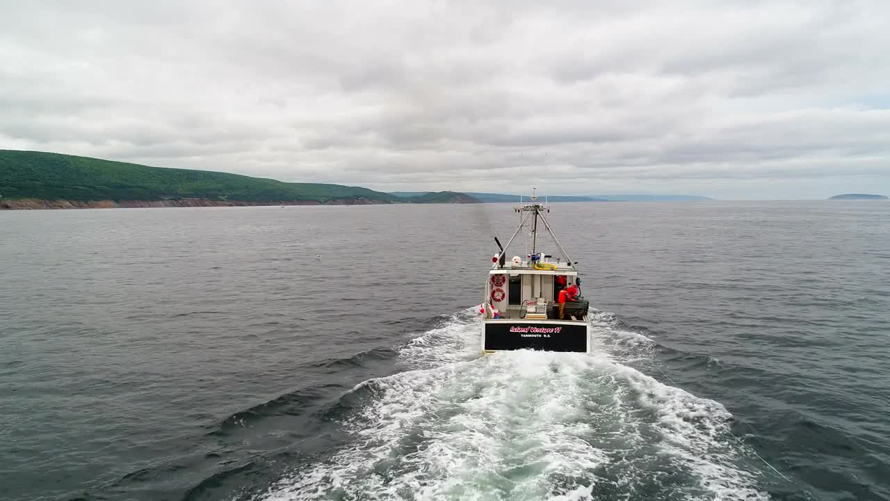 Aerial Of Commercial Fishing Boats Checking Their Lobster Traps In Ocean