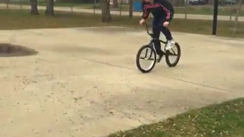 Girl bike flips forward bball court