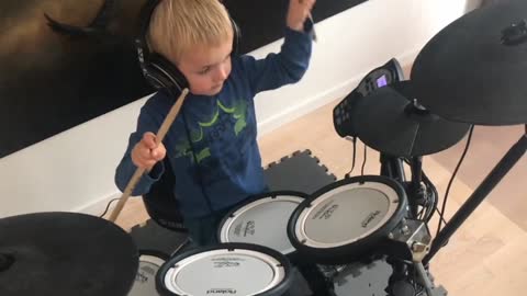 Boy Playing The Drums,Boy Playing The drumsticks for the all topics,3 year old boy playing the drums