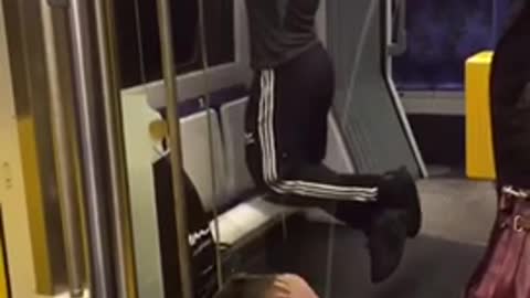 Man in black and white headphones pull ups on bus