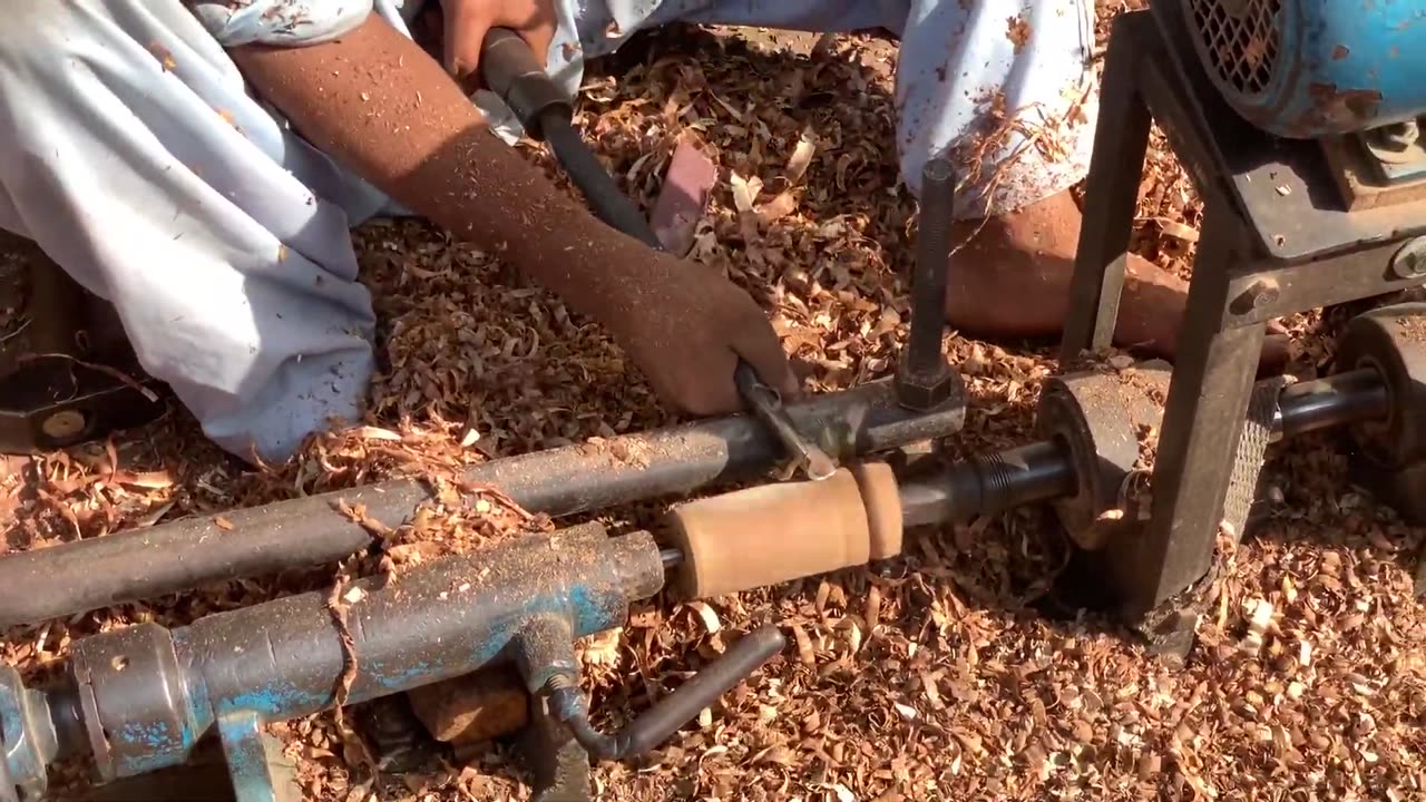 Craftsmanship in Action: Hardworking Artisans Crafting Wooden Furniture