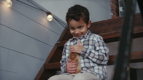 Petting a Bunny while Sitting on a Stairs