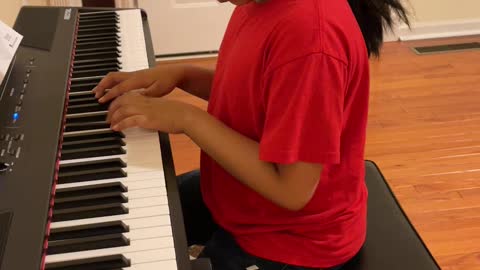 Elleona practicing piano