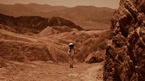 an-astronaut-walking-in-a-desert