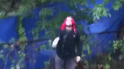 Guy tossing drink and other guy catching it