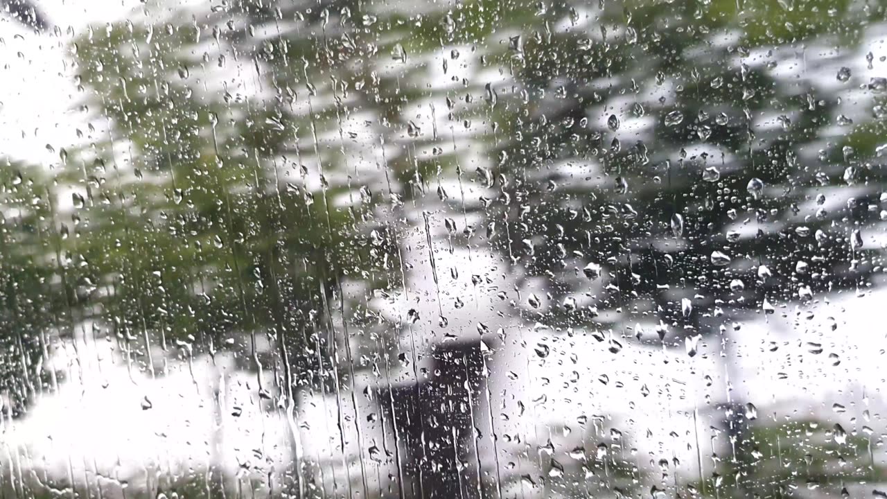 the window of a car on a rainy day