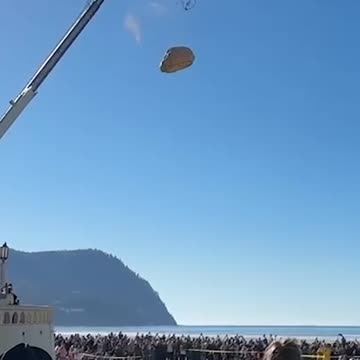 Crowd Gathers for Giant Pumpkin Drop in Seaside, Oregon