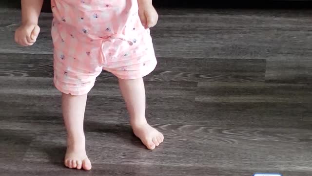 Little girl dancing to The Electric Slide