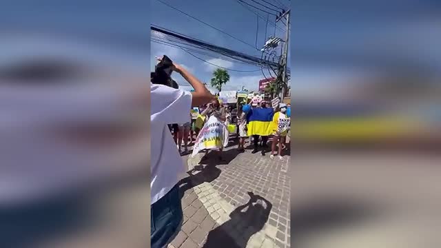 Ukrainian support protest against Russian invasion - Phuket Thailand residents sing national anthem