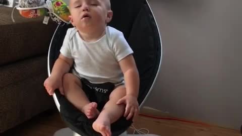 Baby Jax Struggles to Stay Awake in Rocker