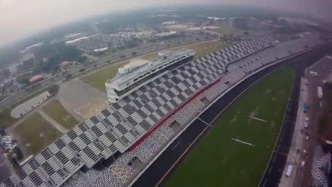 NASCAR driver Brian Vickers sky dives into Daytona speedway