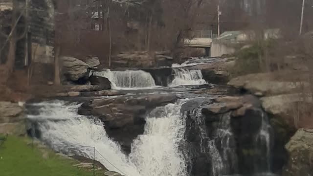 Small town waterfall at normal level.