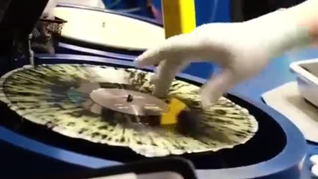 A vinyl record being made.