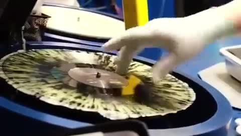 A vinyl record being made.