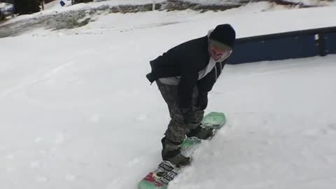 Snowboard turn face goes into rail