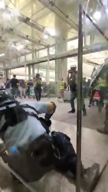 Police and protesters clash at Hong Kong Airport