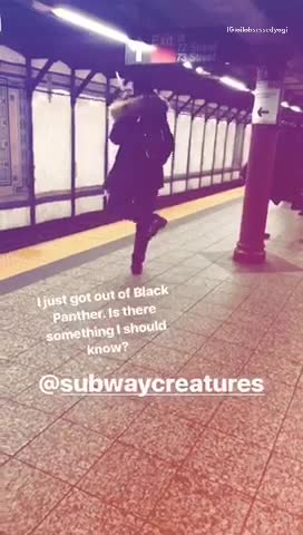 Man uses umbrella as pretend sword on subway platform
