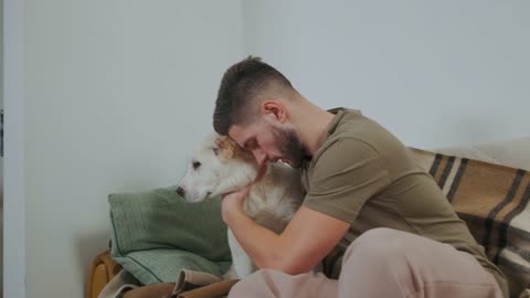 A Man Hugging a Dog