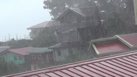 Intense rain on the top roof in a small village