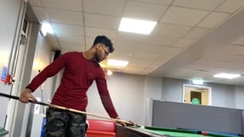 2 guys playing pool