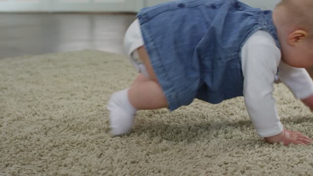 Cute Baby Girl Crawling On The Floor