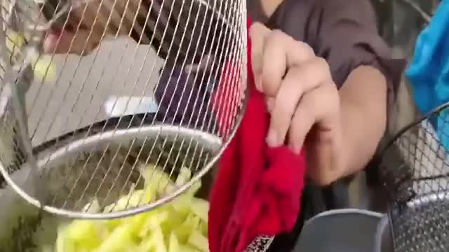 12-year-old child selling French fries on the street - adorable hard-working Afghan kid !!!