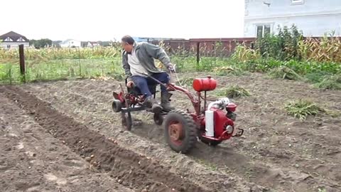 working in fields with machines