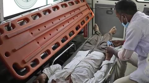 A 22-year-old married woman was gang-raped in the back of an ambulance and her husband