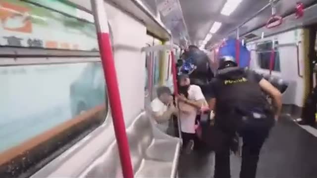 Chinese Stormtroopers Besiege Subway Train as They Beat and Spray Peaceful Citizens